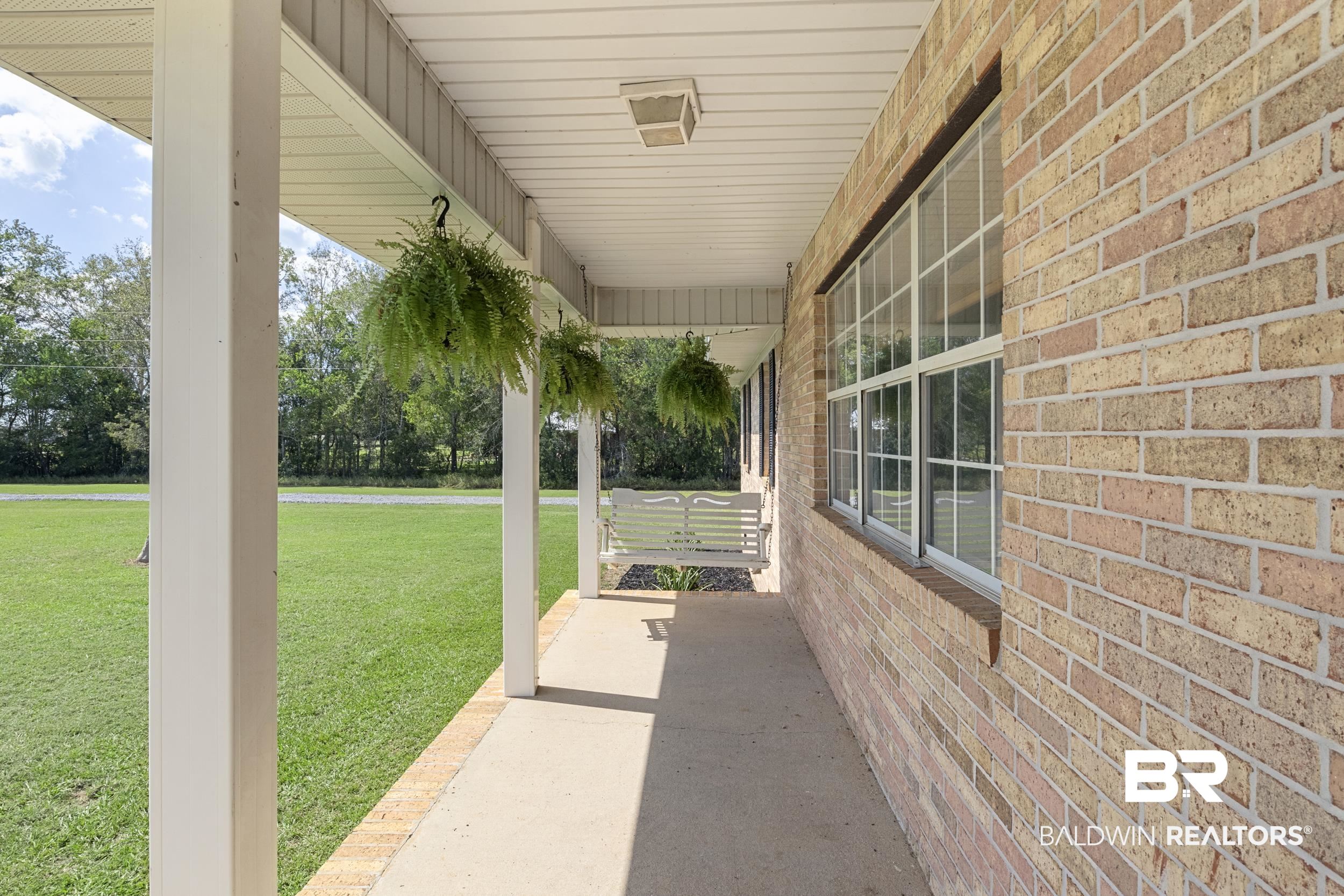 17689 Brewer Road Foley, AL 36535 - Photo 3 of 54 View of patio / terrace with covered porch