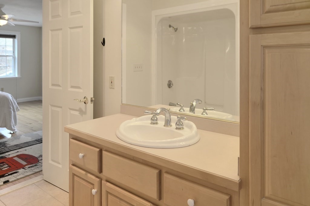 6 Elizabeth Road Auburn, MA 01501 - Photo 19 of 41 a bathroom with a sink a vanity and a mirror