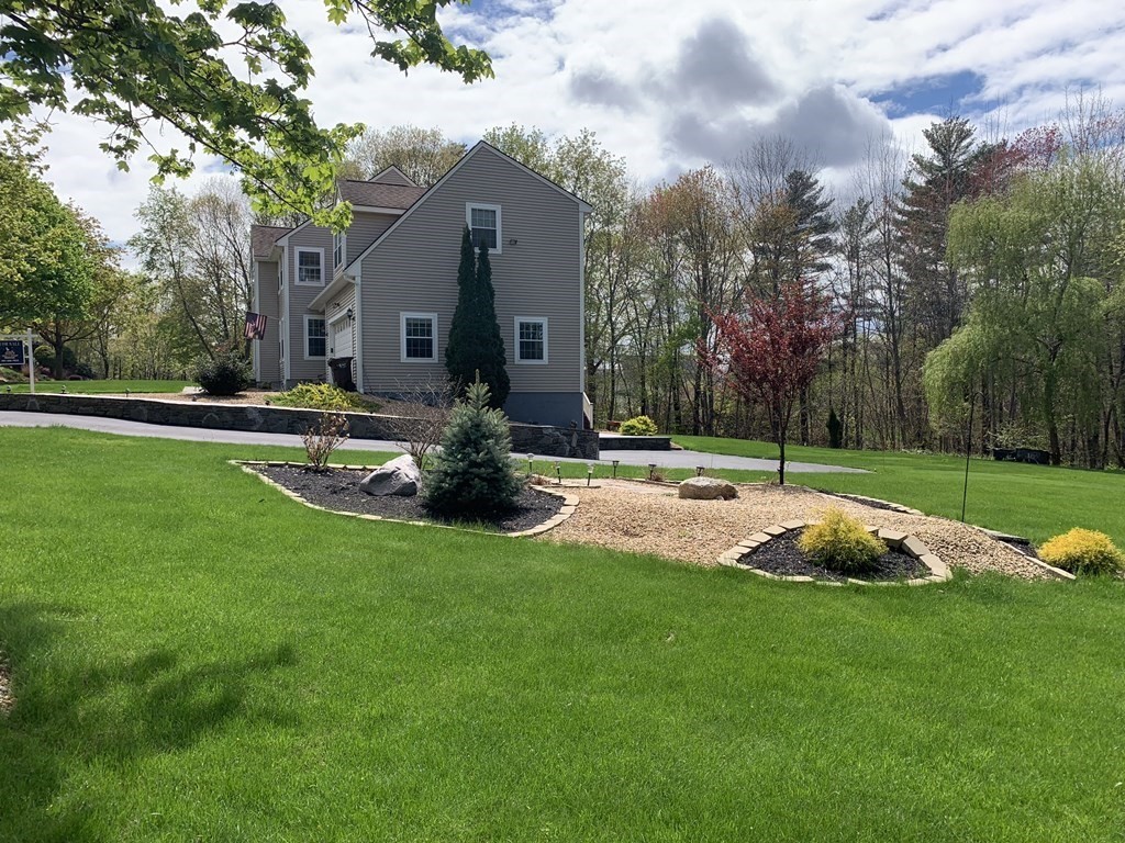 6 Elizabeth Road Auburn, MA 01501 - Photo 2 of 41 a view of a house with a big yard and large trees