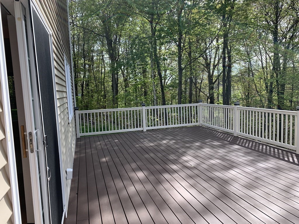 6 Elizabeth Road Auburn, MA 01501 - Photo 31 of 41 a view of backyard with deck and wooden floor