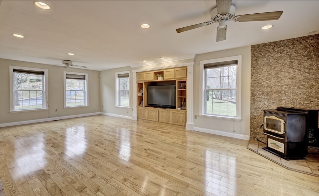6 Elizabeth Road Auburn, MA 01501 - Photo 8 of 41 a view of an empty room with a window and fireplace