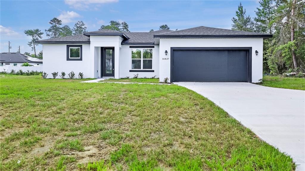 16837 Southwest 47th Court Road Ocala, FL 34473 - Photo 1 of 1 a front view of house with yard