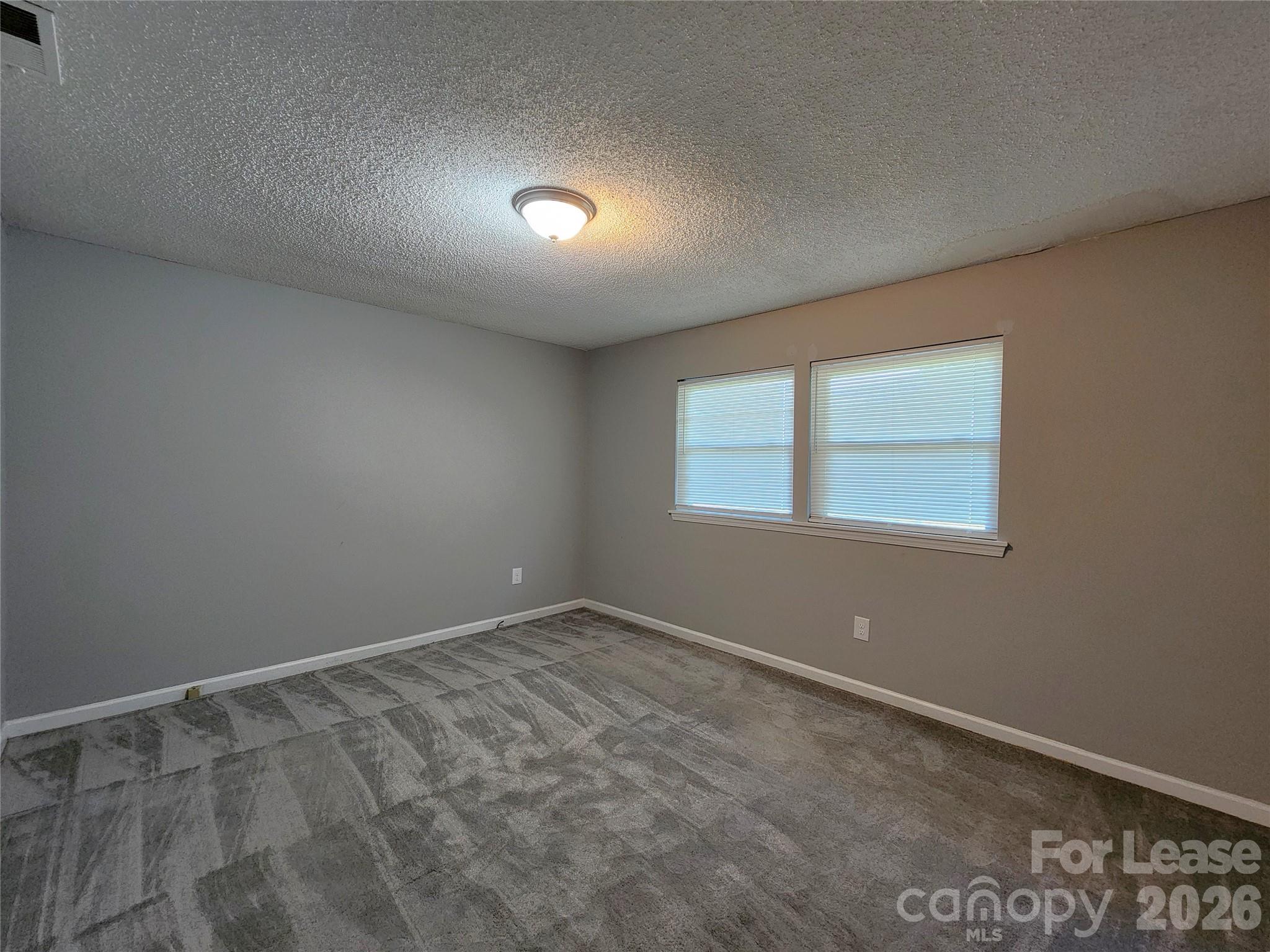 4633 Club View Drive Concord, NC 28025 - Photo 12 of 16 an empty room with a window
