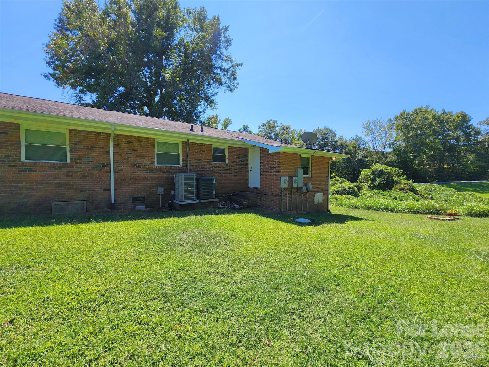 4633 Club View Drive Concord, NC 28025 - Photo 14 of 16 a view of a house with backyard and garden