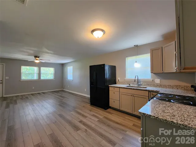 a kitchen with a stove a refrigerator and a stove