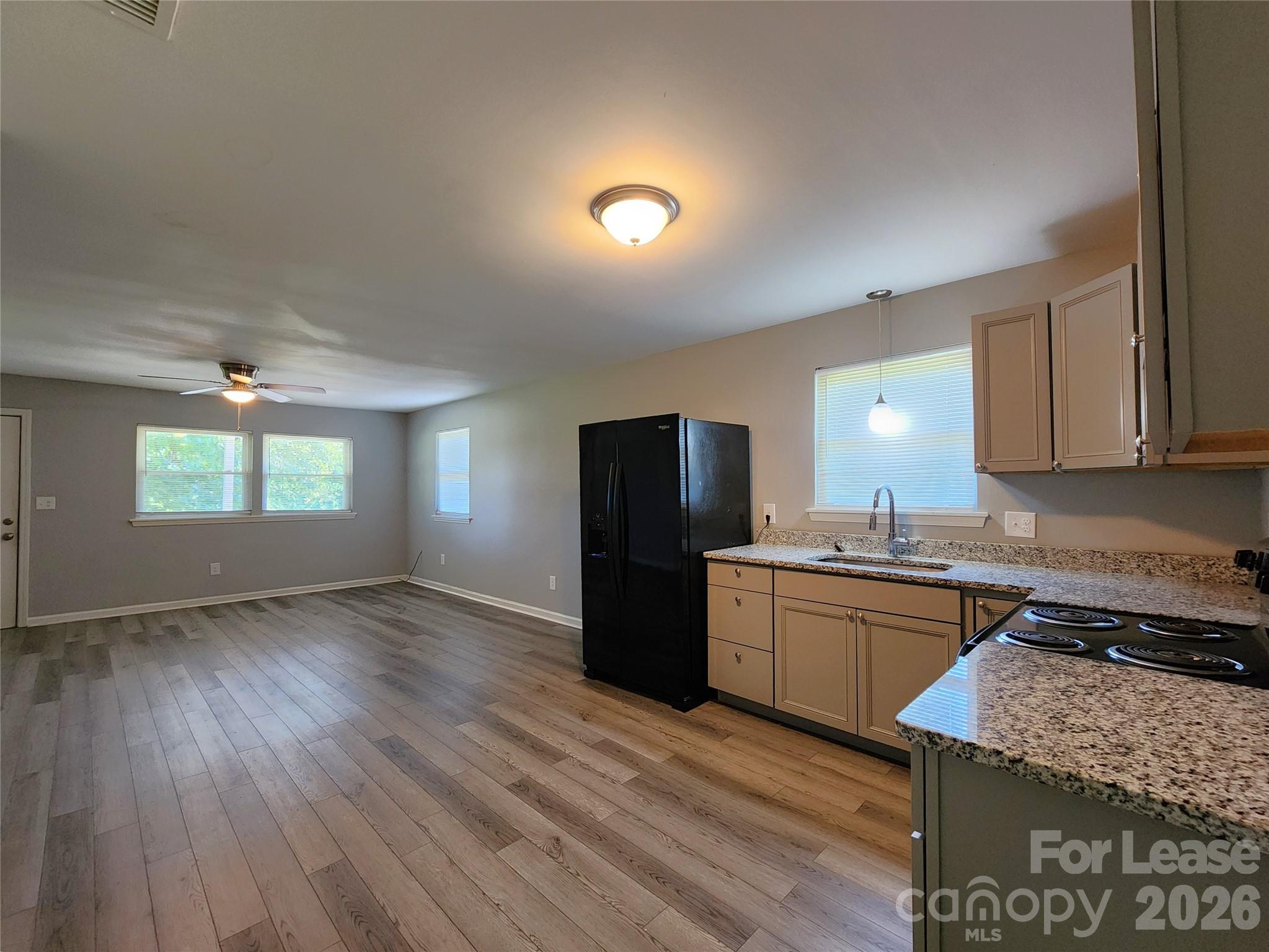 4633 Club View Drive Concord, NC 28025 - Photo 7 of 16 a kitchen with a stove a refrigerator and a stove