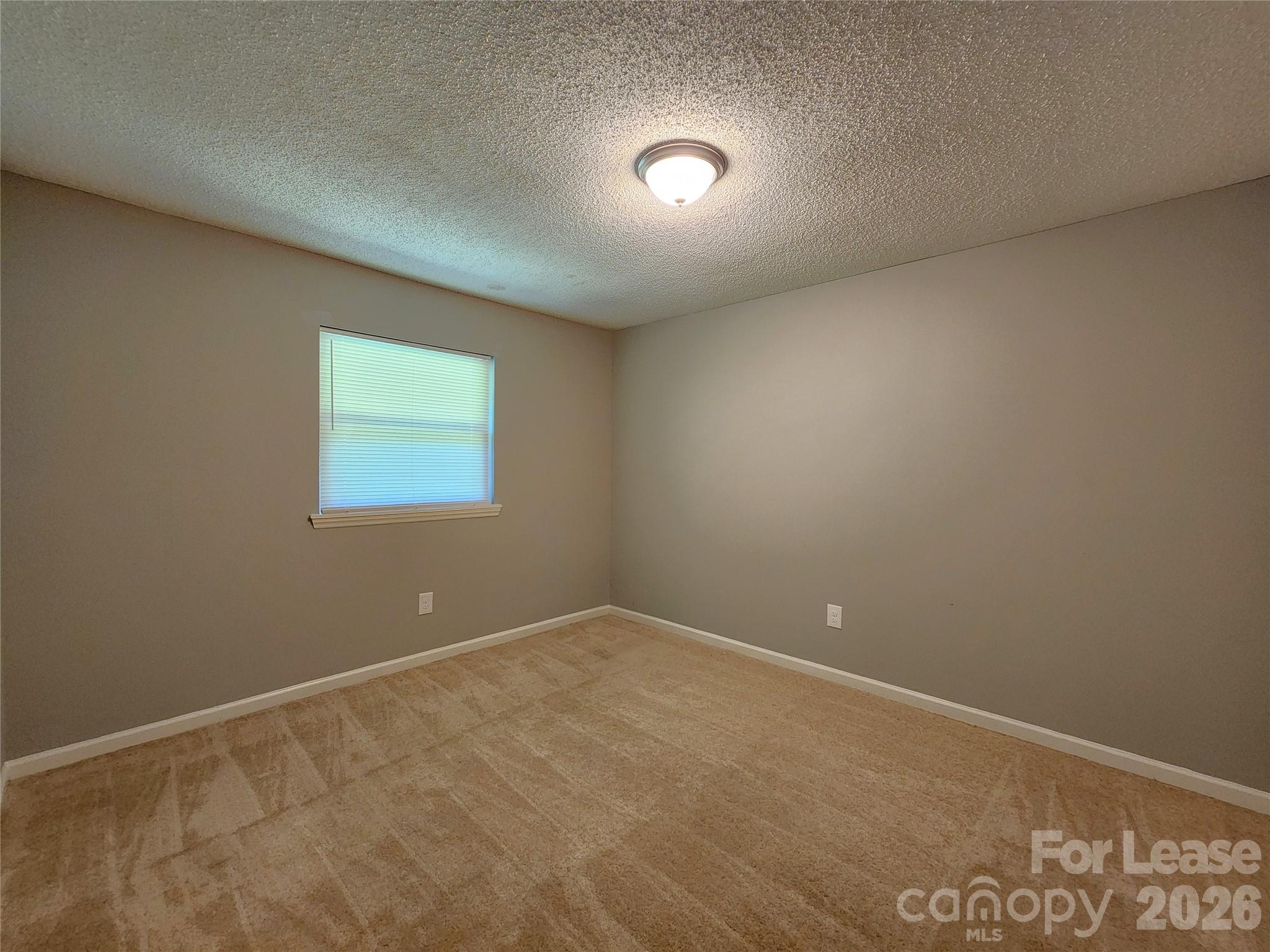 4633 Club View Drive Concord, NC 28025 - Photo 8 of 16 an empty room with a workbench