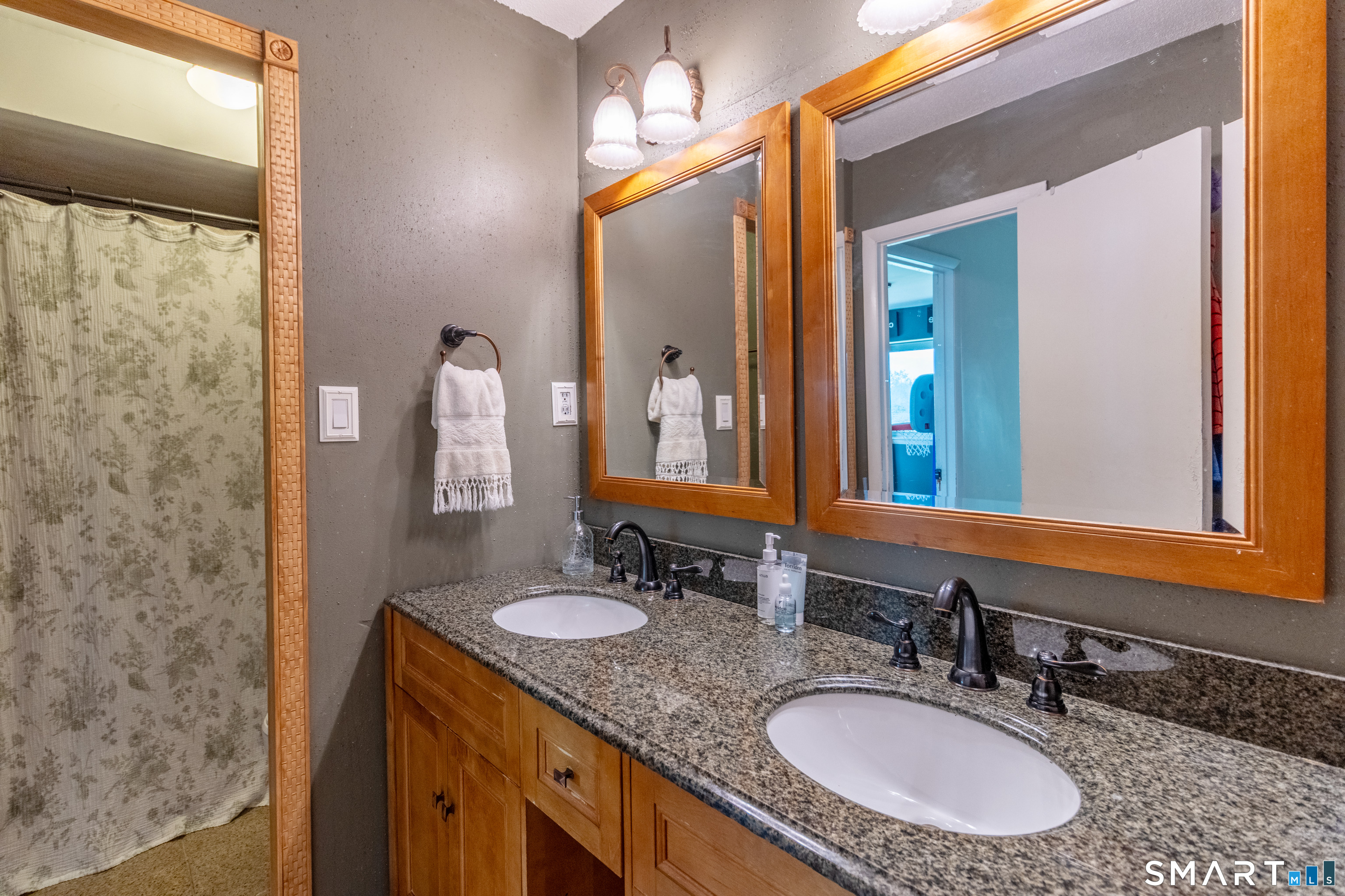 94 Cottonwood Road, Unit 94 Newington, CT 06111 - Photo 18 of 33 Full Bathroom with double vanity, storage closet and separate shower/toilet room.
