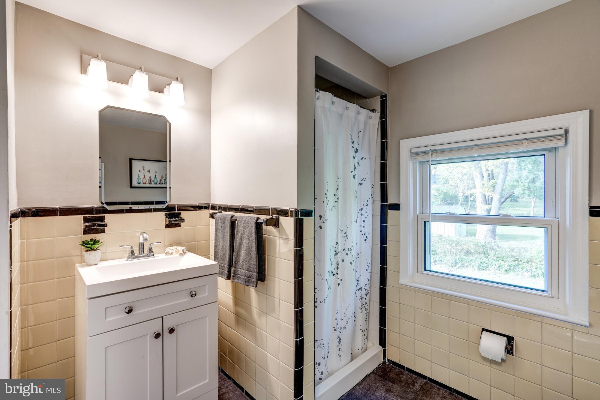 12504 Denley Road Silver Spring, MD 20906 - Photo 19 of 30 Upper bath w/new flr., sink cab.,/faucet, lighting