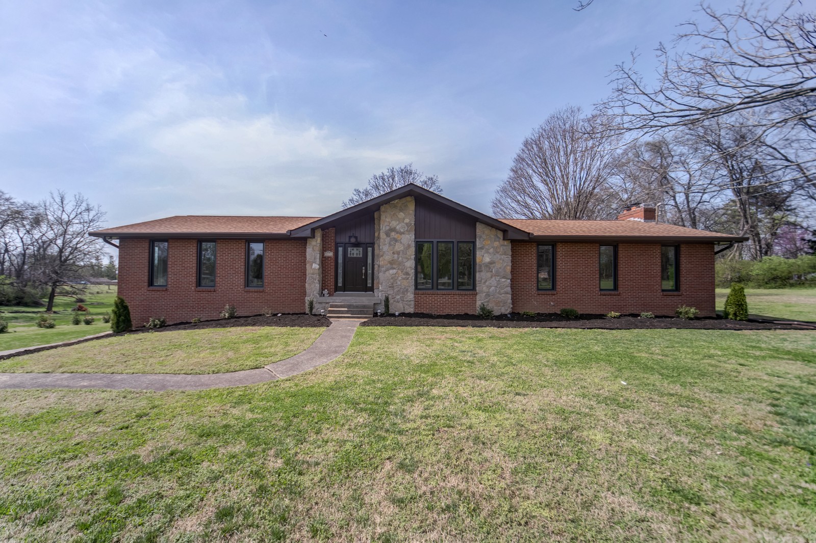 3975 Nonaville Road Mount Juliet, TN 37122 - Photo 1 of 55 a front view of a house with a garden