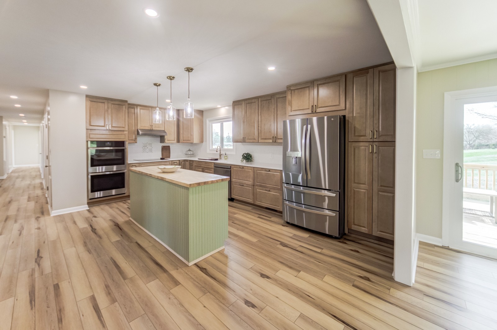 3975 Nonaville Road Mount Juliet, TN 37122 - Photo 14 of 55 a kitchen with kitchen island a sink stainless steel appliances and cabinets