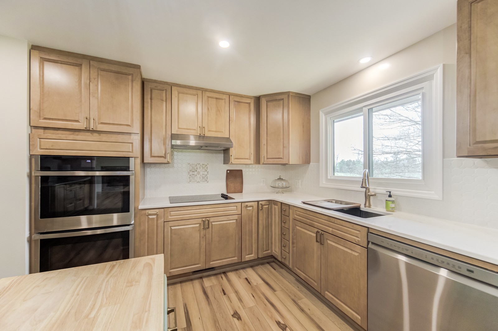 3975 Nonaville Road Mount Juliet, TN 37122 - Photo 15 of 55 a kitchen with a sink stove and cabinets