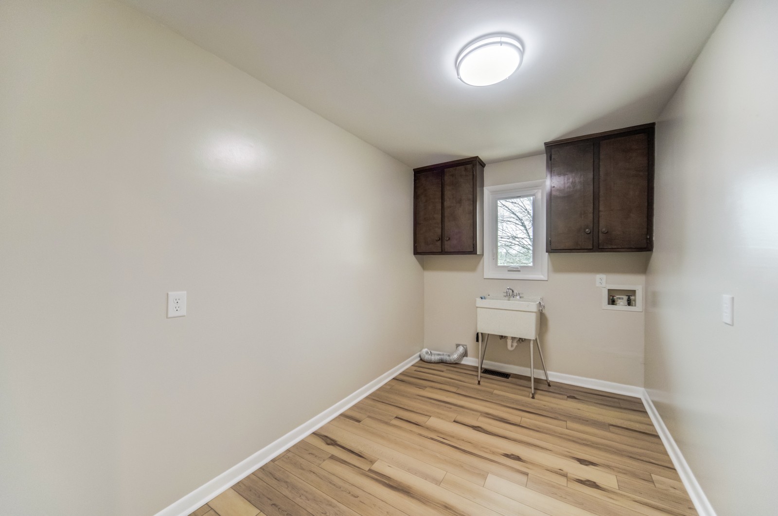3975 Nonaville Road Mount Juliet, TN 37122 - Photo 20 of 55 a view of a livingroom with wooden floor and a flat screen tv