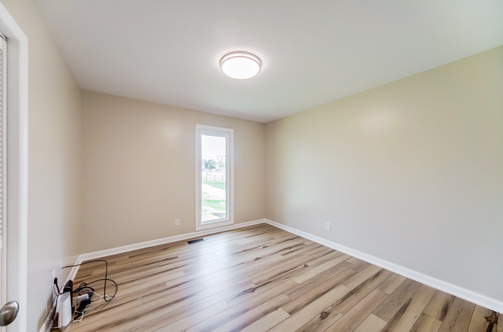 3975 Nonaville Road Mount Juliet, TN 37122 - Photo 22 of 55 an empty room with wooden floor and windows