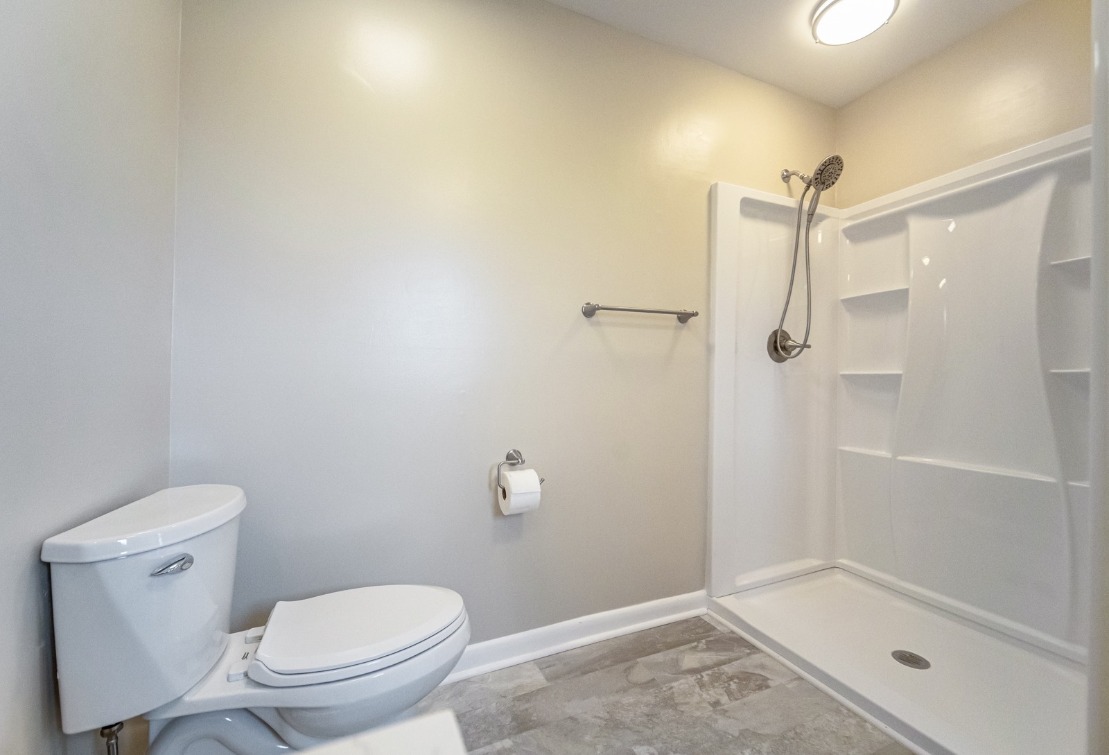 3975 Nonaville Road Mount Juliet, TN 37122 - Photo 30 of 55 a bathroom with a granite countertop toilet and a shower