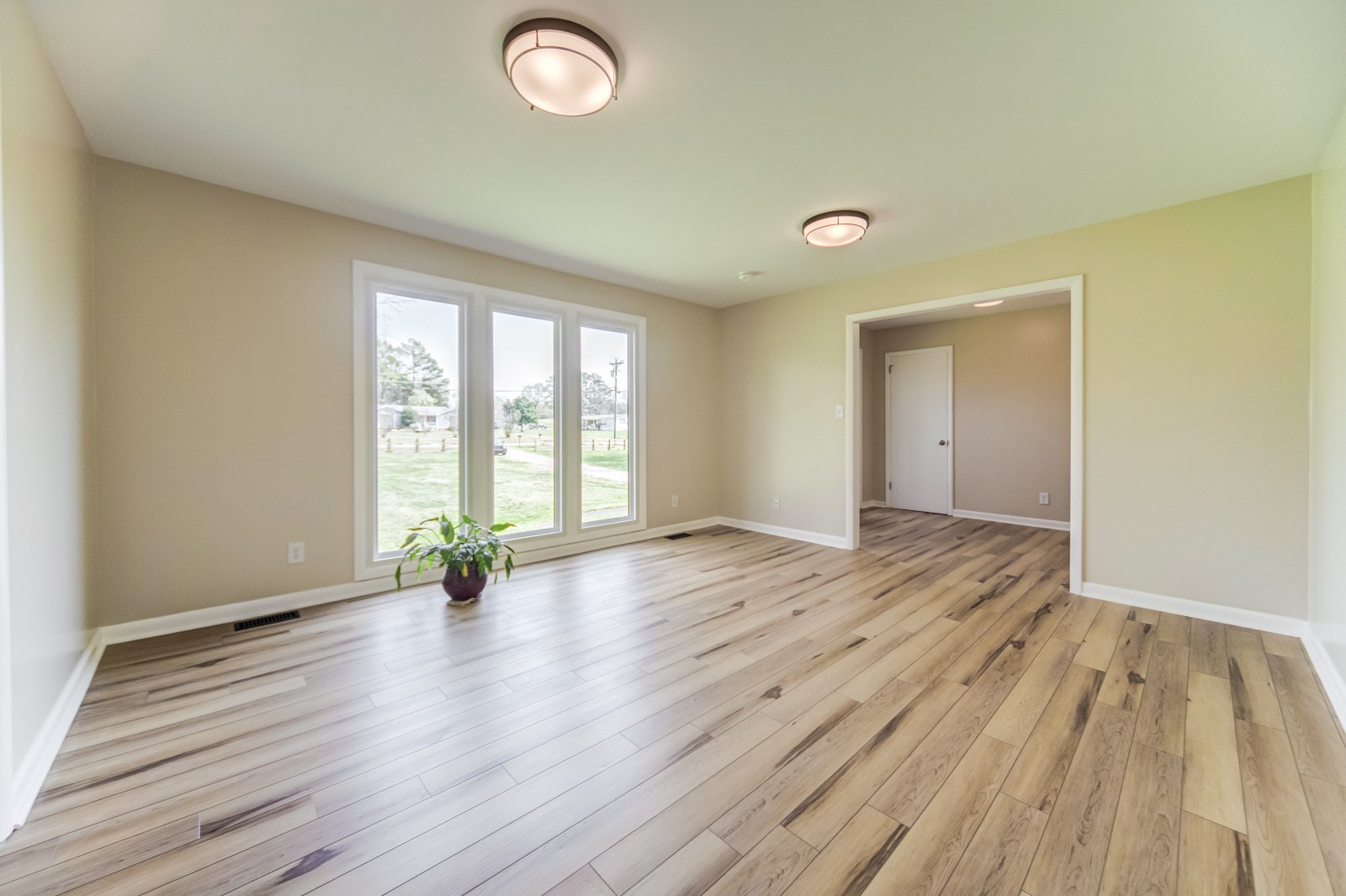 3975 Nonaville Road Mount Juliet, TN 37122 - Photo 9 of 55 an empty room with wooden floor and windows
