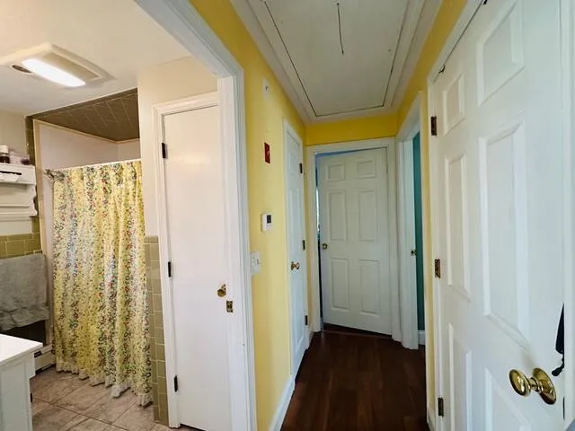 a view of a bathroom with a shower and a sink