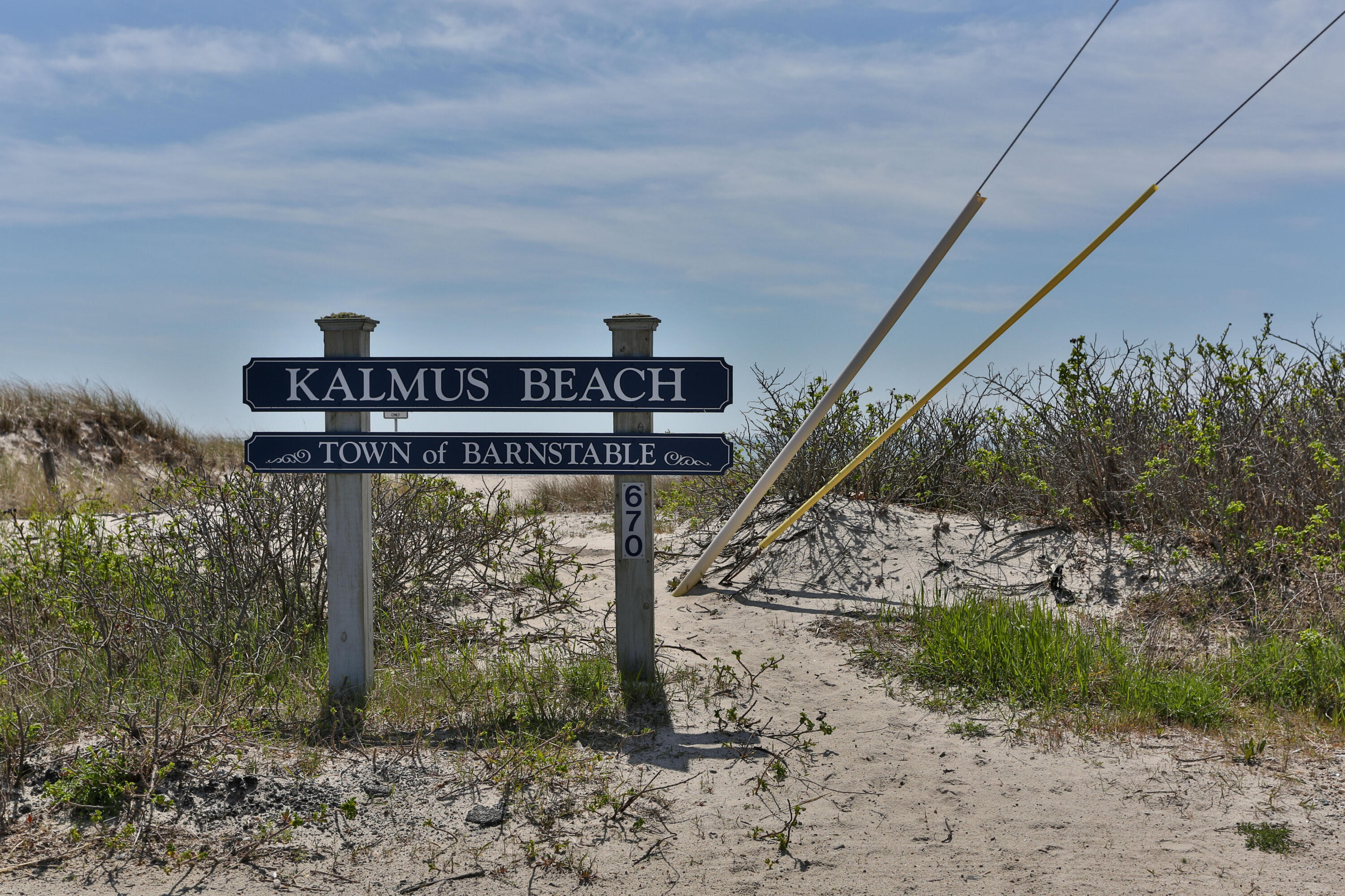 8 Jasmine Lane Hyannis, MA 02601 - Photo 25 of 28 a street sign on a wooden wall
