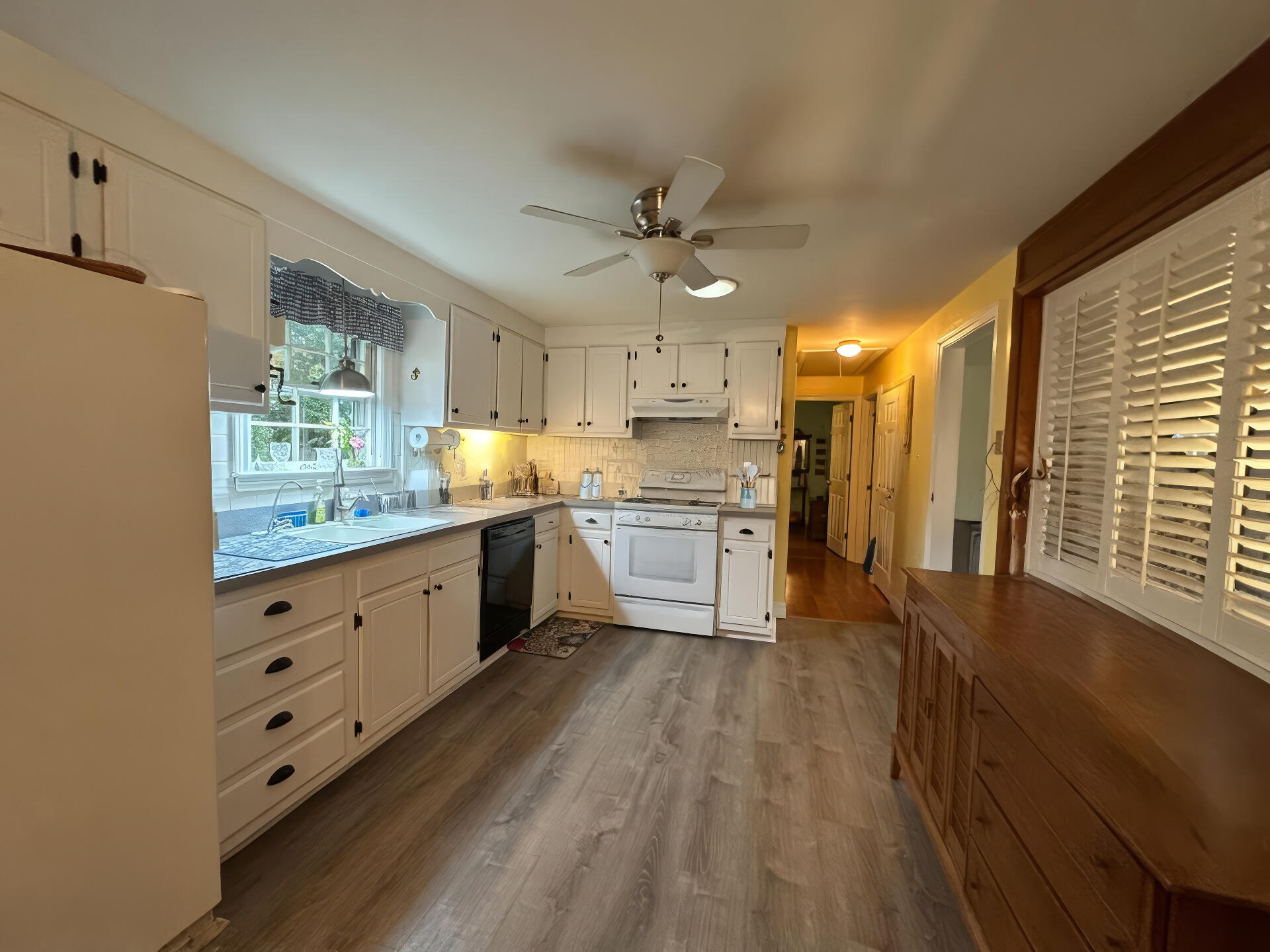 8 Jasmine Lane Hyannis, MA 02601 - Photo 5 of 28 a large kitchen with granite countertop a large window a stove a sink a window and stainless steel appliances