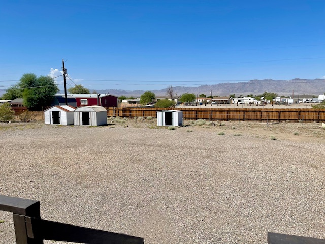 5075 Mountain View Road Fort Mohave, AZ 86426 - Photo 27 of 27 View of yard with storage sheds and a mountain view
