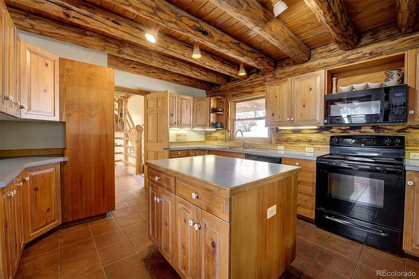 a kitchen that has a cabinets and a sink