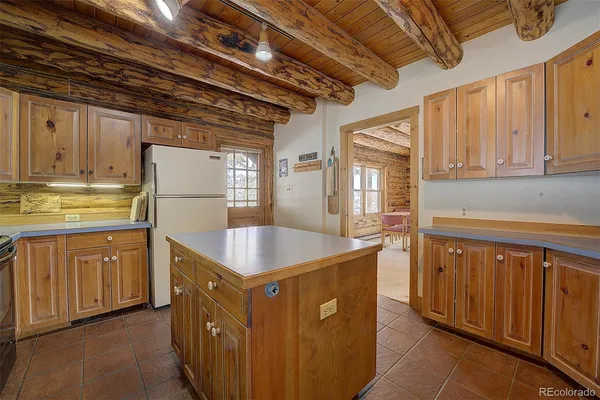 a kitchen with stainless steel appliances granite countertop a sink a stove and a microwave