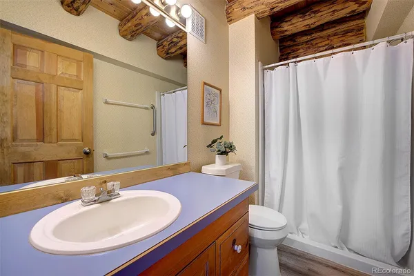 a bedroom with bed and a window