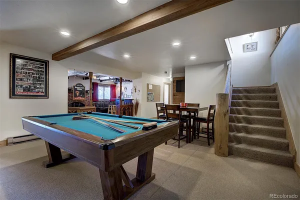 a room with furniture and air hockey table