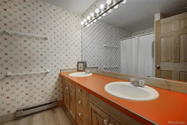 a bedroom with two beds and a window
