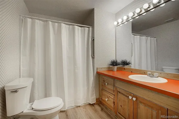 a view of balcony with wooden floor and seating space