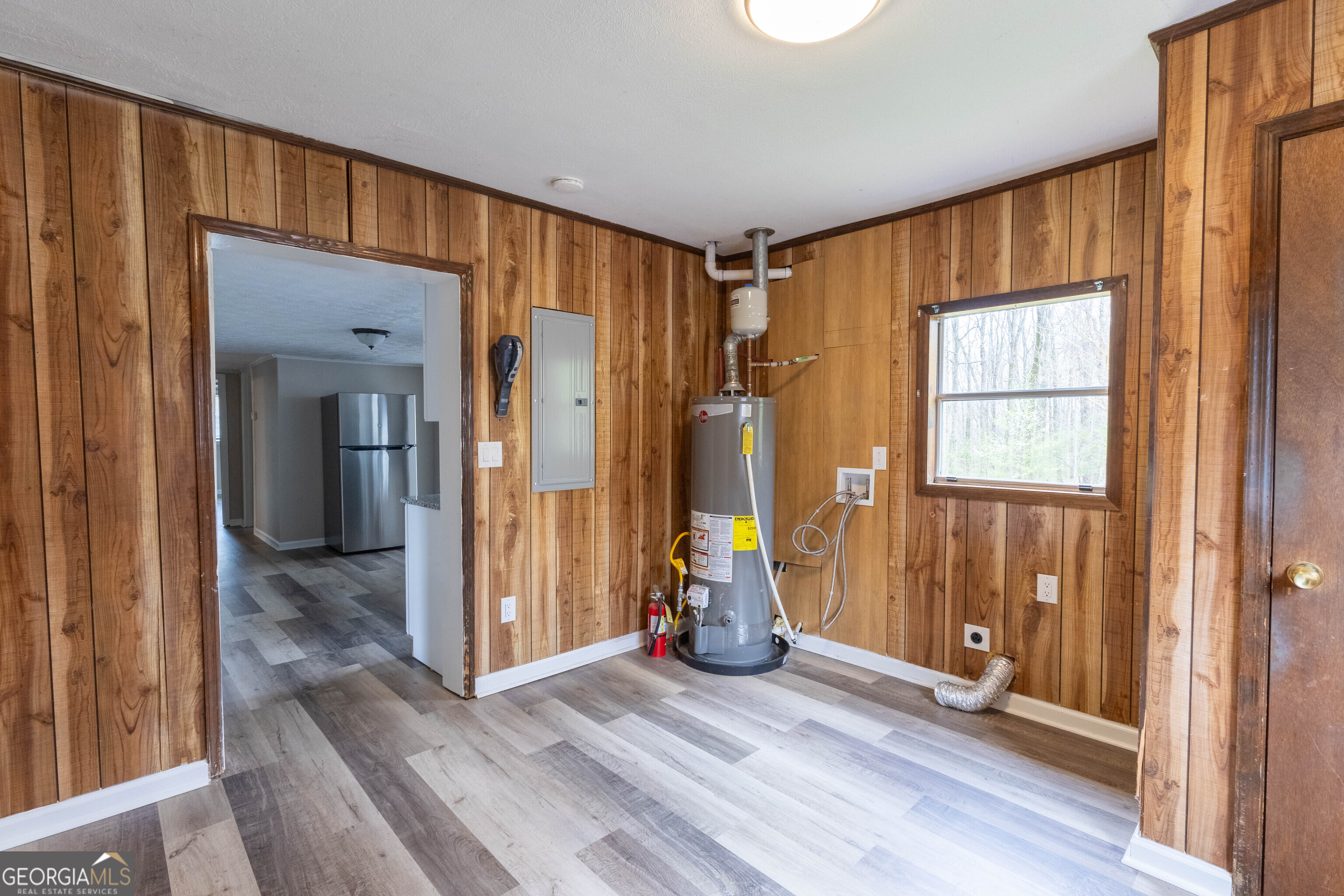 5326 Heardsville Road Cumming, GA 30028 - Photo 20 of 22 a view of a room with wooden floor and windows
