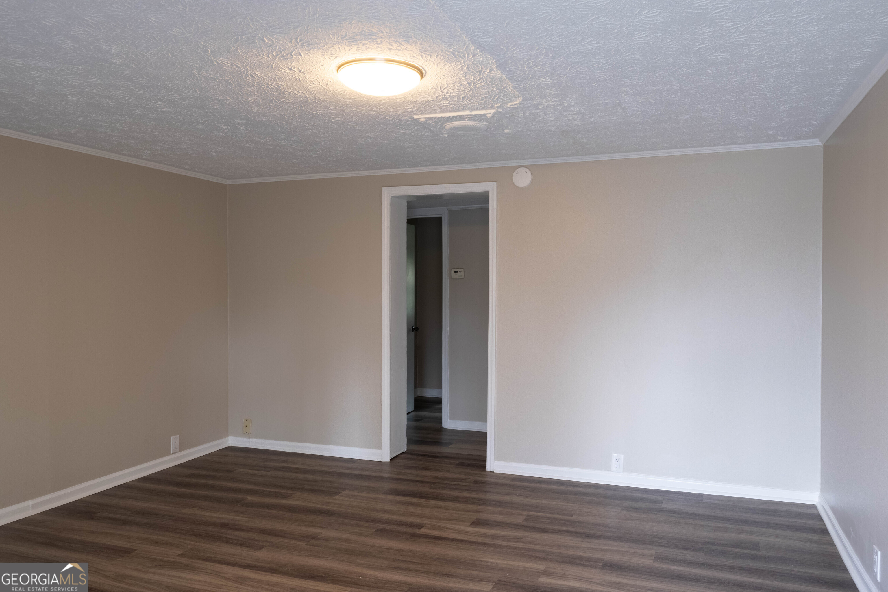 5326 Heardsville Road Cumming, GA 30028 - Photo 6 of 22 a view of an empty room with wooden floor