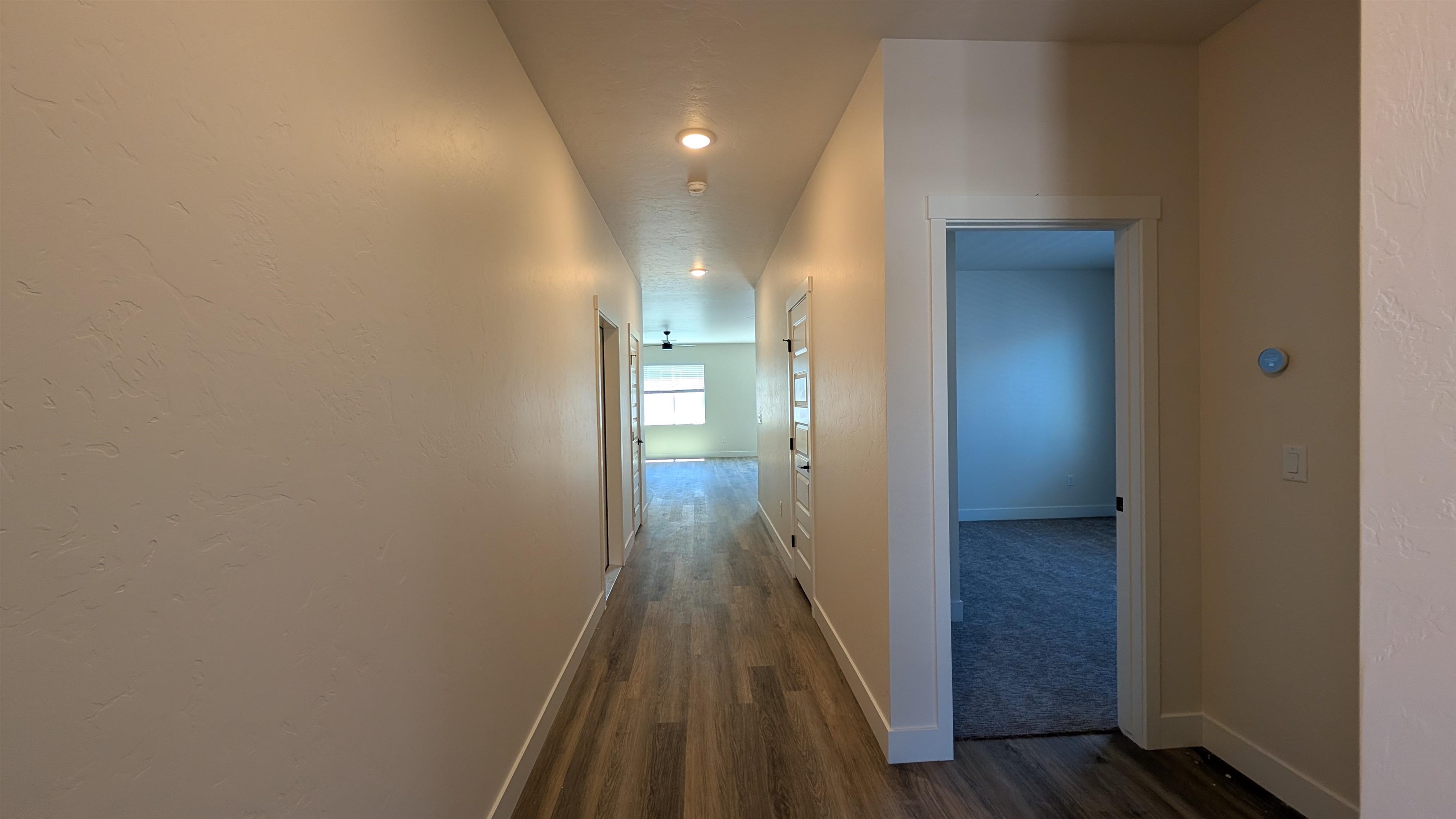 1660 Rusty Rivet Road Fruita, CO 81521 - Photo 12 of 15 a view of hallway with wooden floor