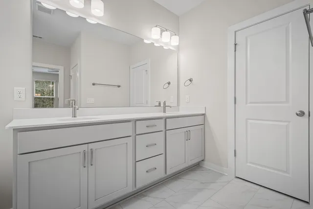 a bathroom with a tub sink and shower