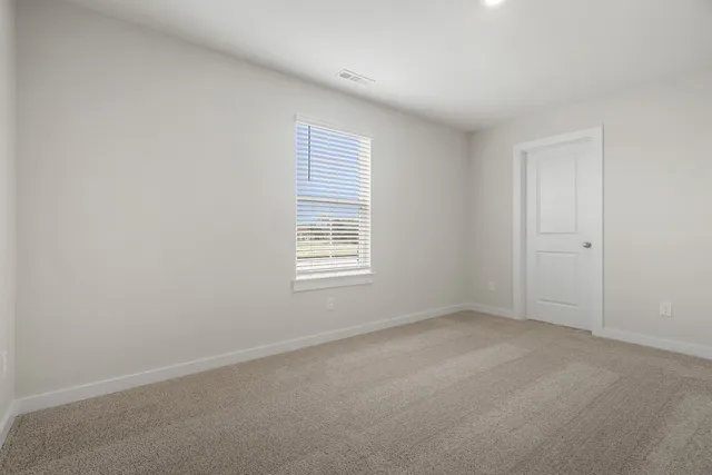 a bathroom with a double vanity sink a mirror and shower