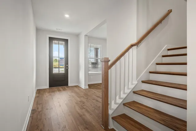 a view of entryway with wooden floor