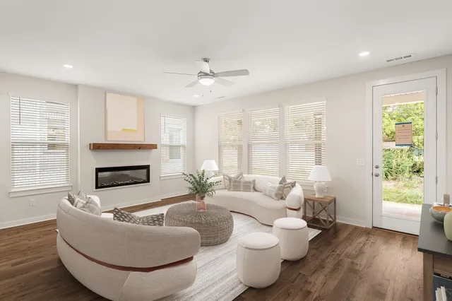 a living room with furniture and a fireplace