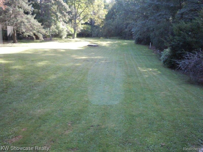 2442 Charms Road Wixom, MI 48393 - Photo 16 of 18 Fenced Backyard