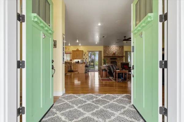 a kitchen with counter space dining table and chairs