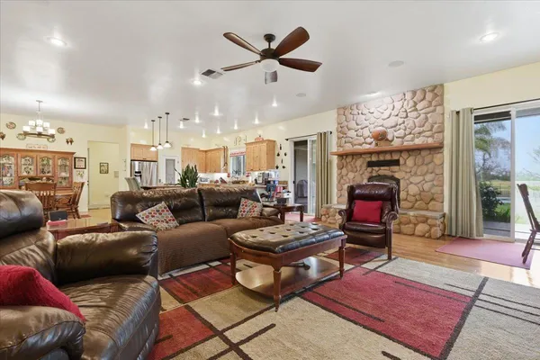 a kitchen with granite countertop a sink stainless steel appliances and cabinets