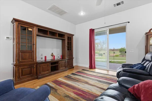 a room with furniture and a book shelf