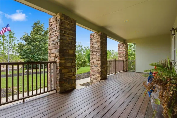 a living room with furniture a rug and a chandelier
