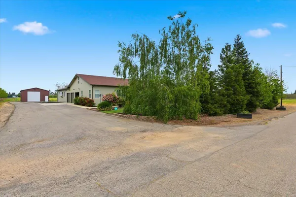 a living room with furniture a dining table and a piano