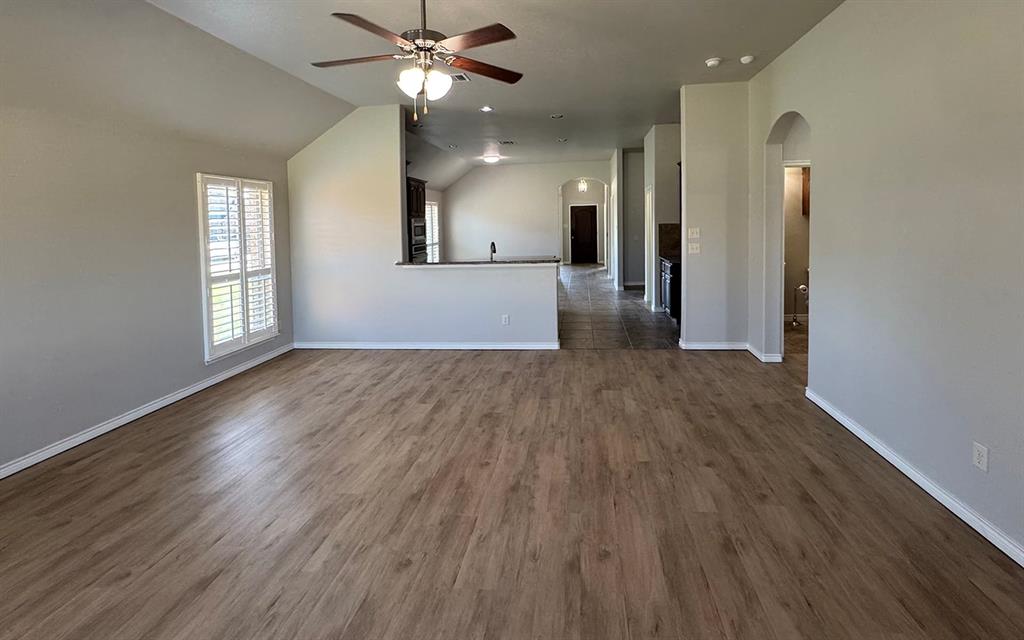 1113 Seguin Road Forney, TX 75126 - Photo 18 of 32 wooden floor in an empty room with a window