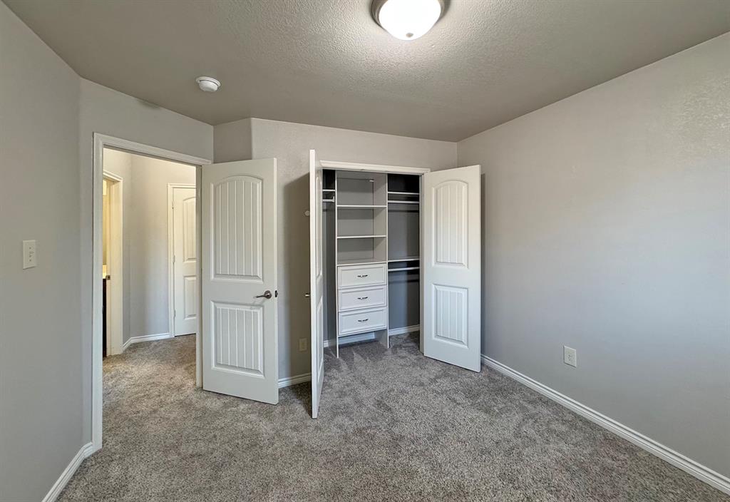 1113 Seguin Road Forney, TX 75126 - Photo 24 of 32 an empty room with closet and a window