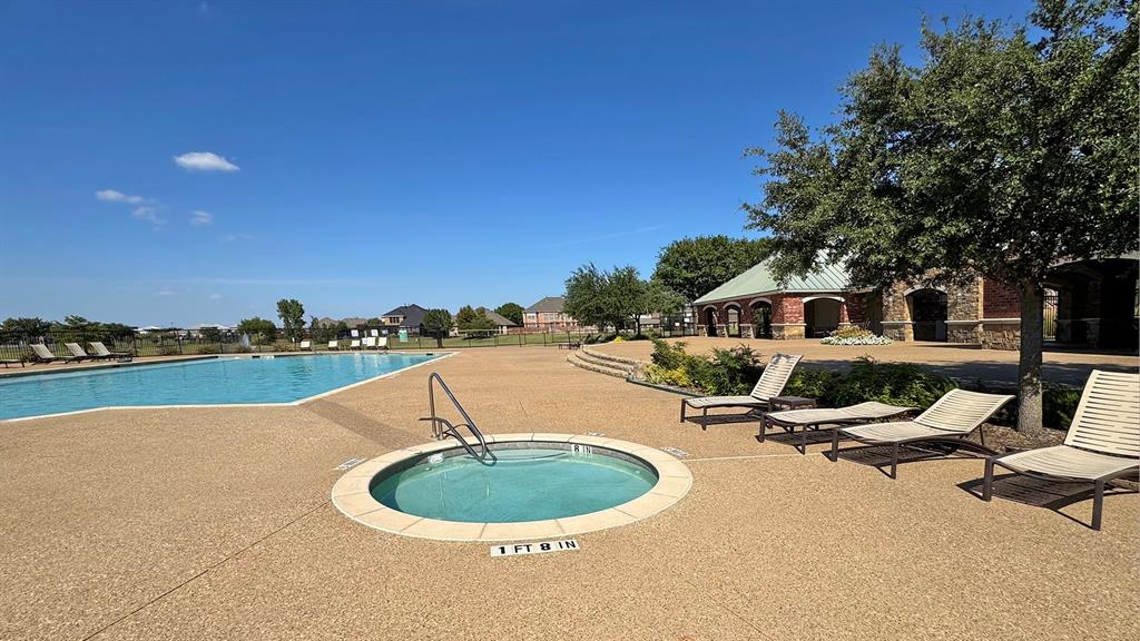 1113 Seguin Road Forney, TX 75126 - Photo 31 of 32 a view of a swimming pool and lounge chair