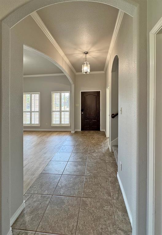 1113 Seguin Road Forney, TX 75126 - Photo 7 of 32 a view of an empty room with a fireplace and a window