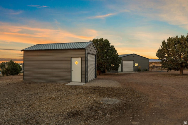 2925 Juniper Road Enterprise, UT 84725 - Photo 5 of 56 Garage at dusk with a detached garage