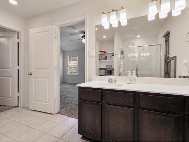 1223 Trevino Road Forney, TX 75126 - Photo 9 of 20 a bathroom with a sink and a mirror