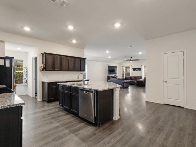 1223 Trevino Road Forney, TX 75126 - Photo 20 of 20 a large kitchen with stainless steel appliances and a stove top oven